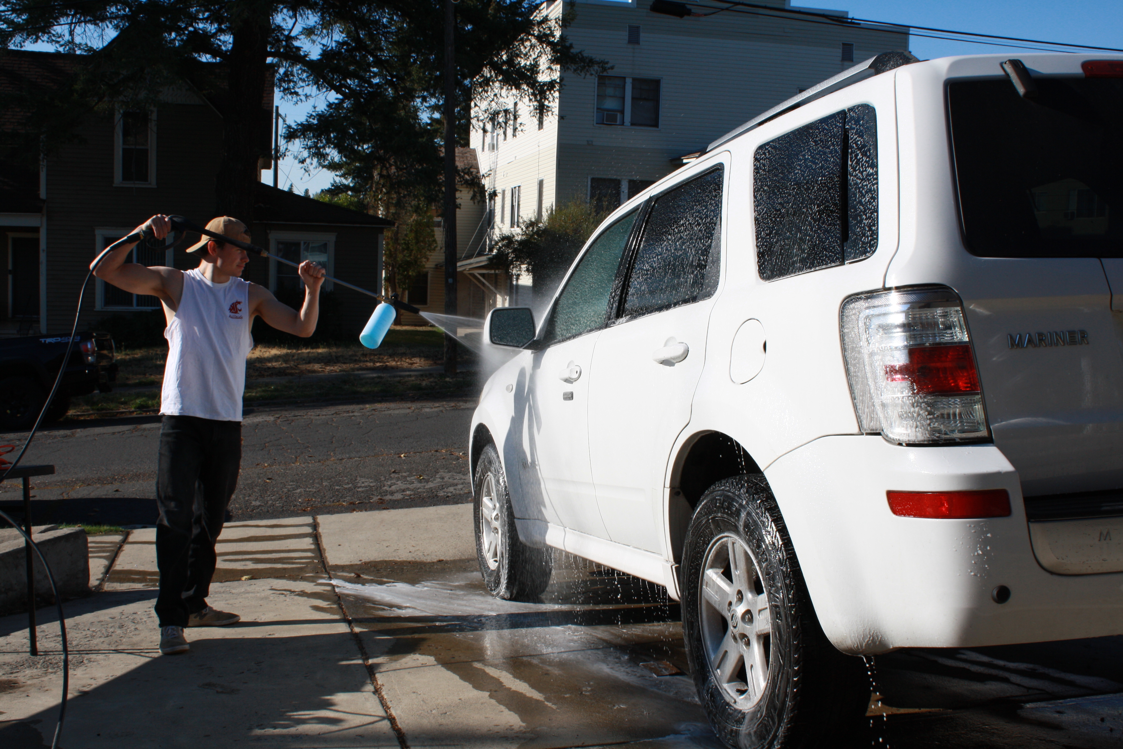 Aidan washing a car